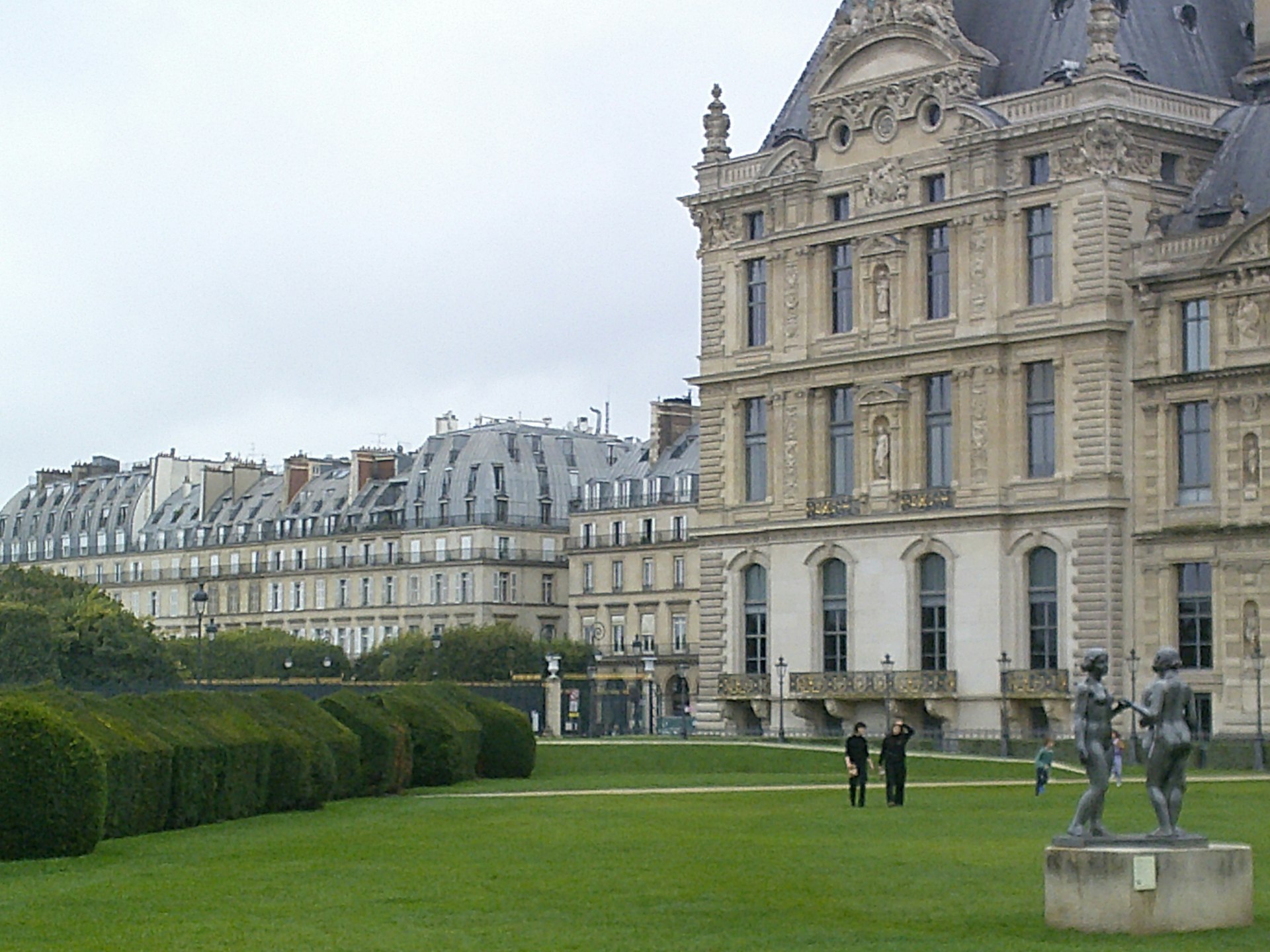 A large building with a statue in front of it